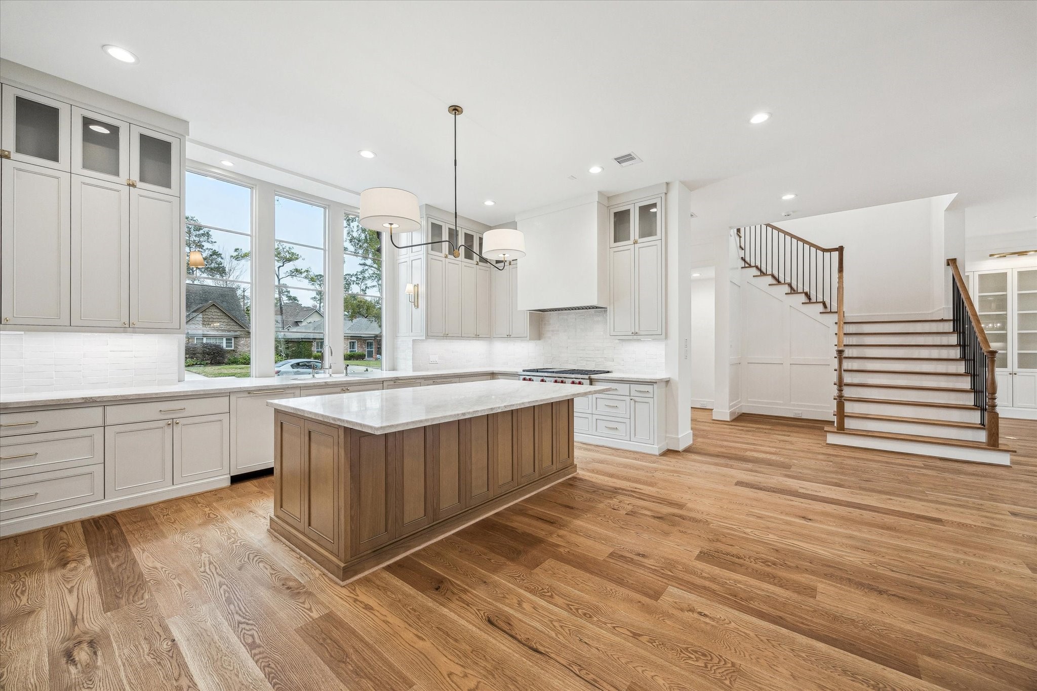 13023 Taylorcrest Road Houston, TX 77079 - Photo 8 of 49 a kitchen with stainless steel appliances granite countertop a sink a stove and a wooden floors