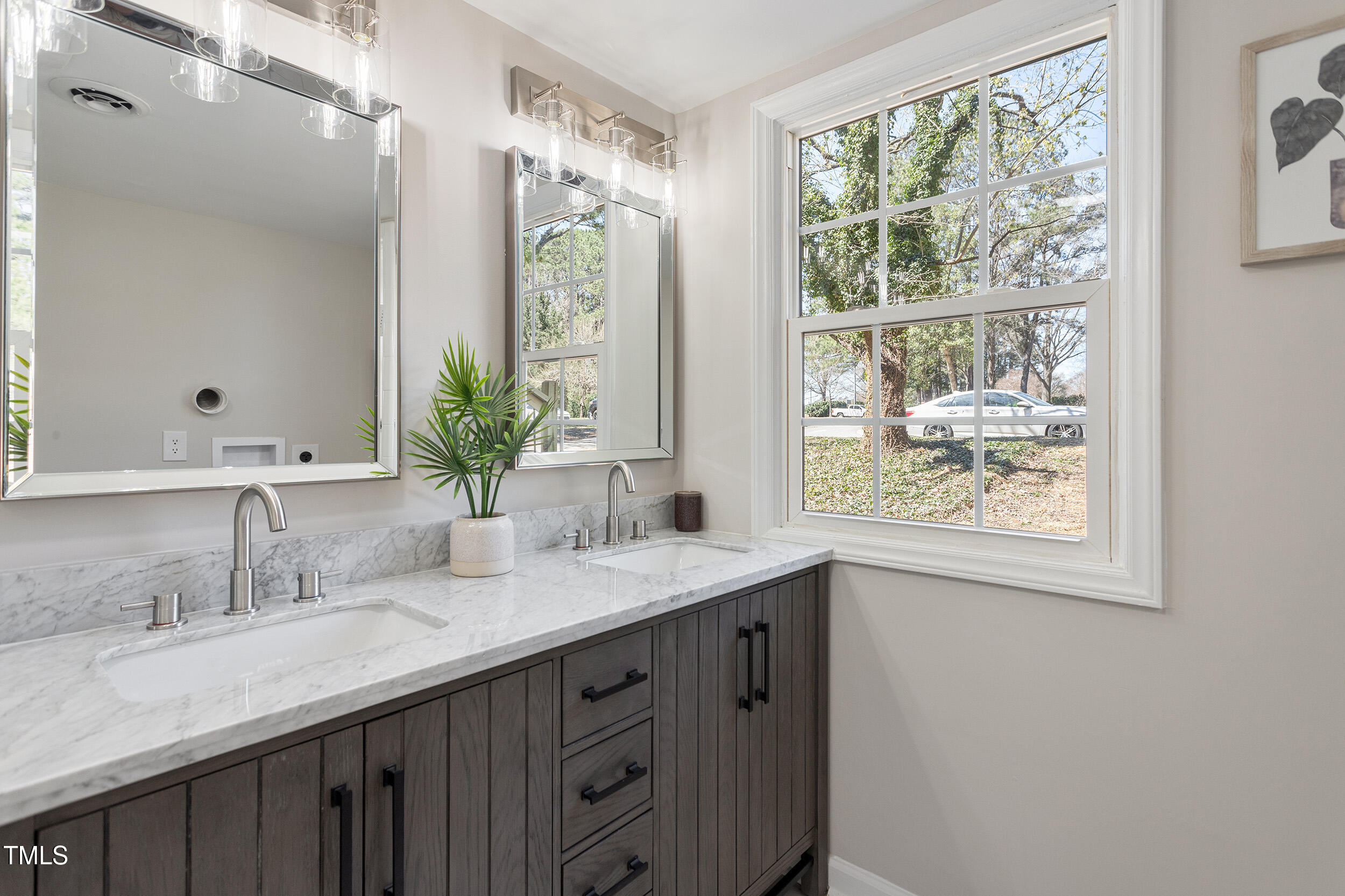4204 Green Road Raleigh, NC 27604 - Photo 19 of 39 a bathroom with a double vanity sink and a mirror