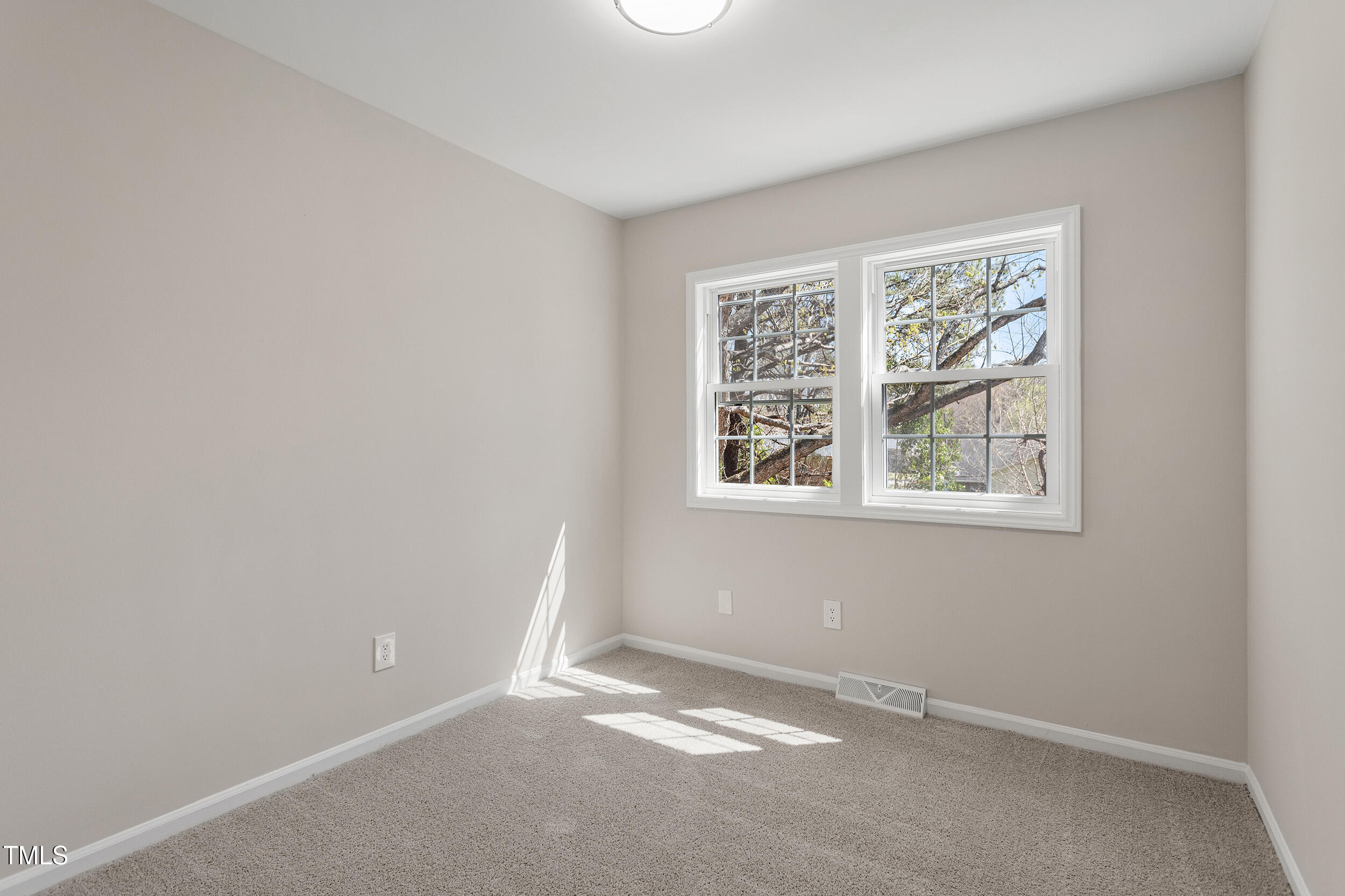 4204 Green Road Raleigh, NC 27604 - Photo 27 of 39 an empty room with windows