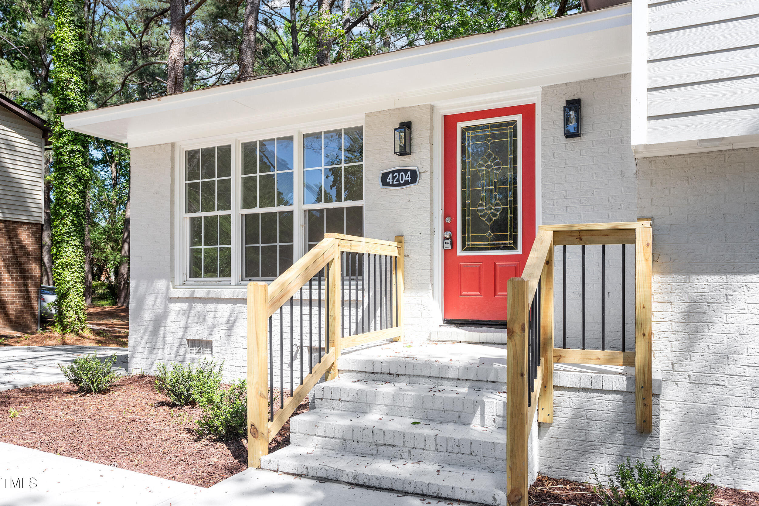 4204 Green Road Raleigh, NC 27604 - Photo 38 of 39 a front view of a house with a porch