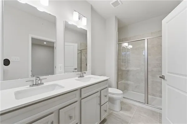 a bathroom with a tub a sink and mirror