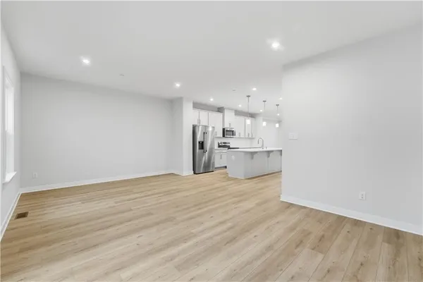 a view of kitchen with wooden floor