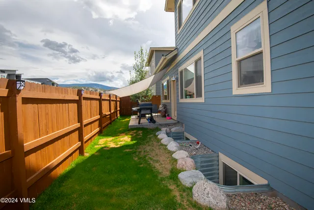 a view of a backyard with sitting area