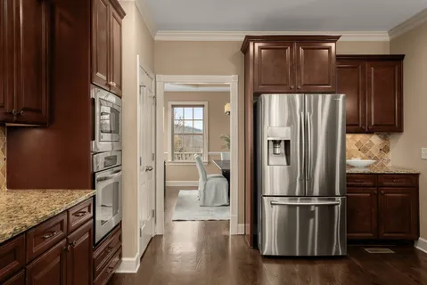a bedroom with a bed and ceiling fan