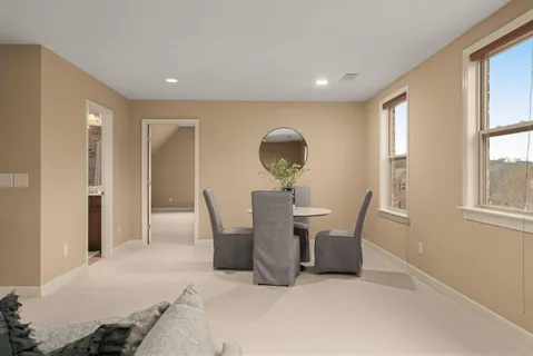 a bedroom with a bed and a table