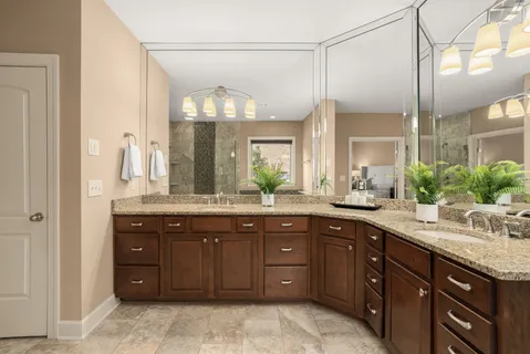 a view of a hallway with wooden floor and windows