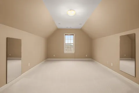 a bedroom with a bed and a table