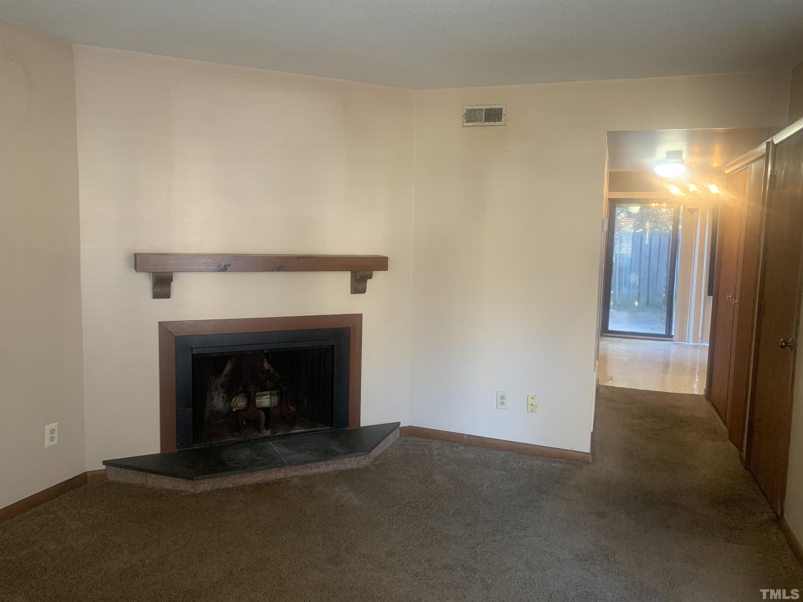 5852 Shady Grove Circle Raleigh, NC 27609 - Photo 3 of 13 a view of an empty room with fire place