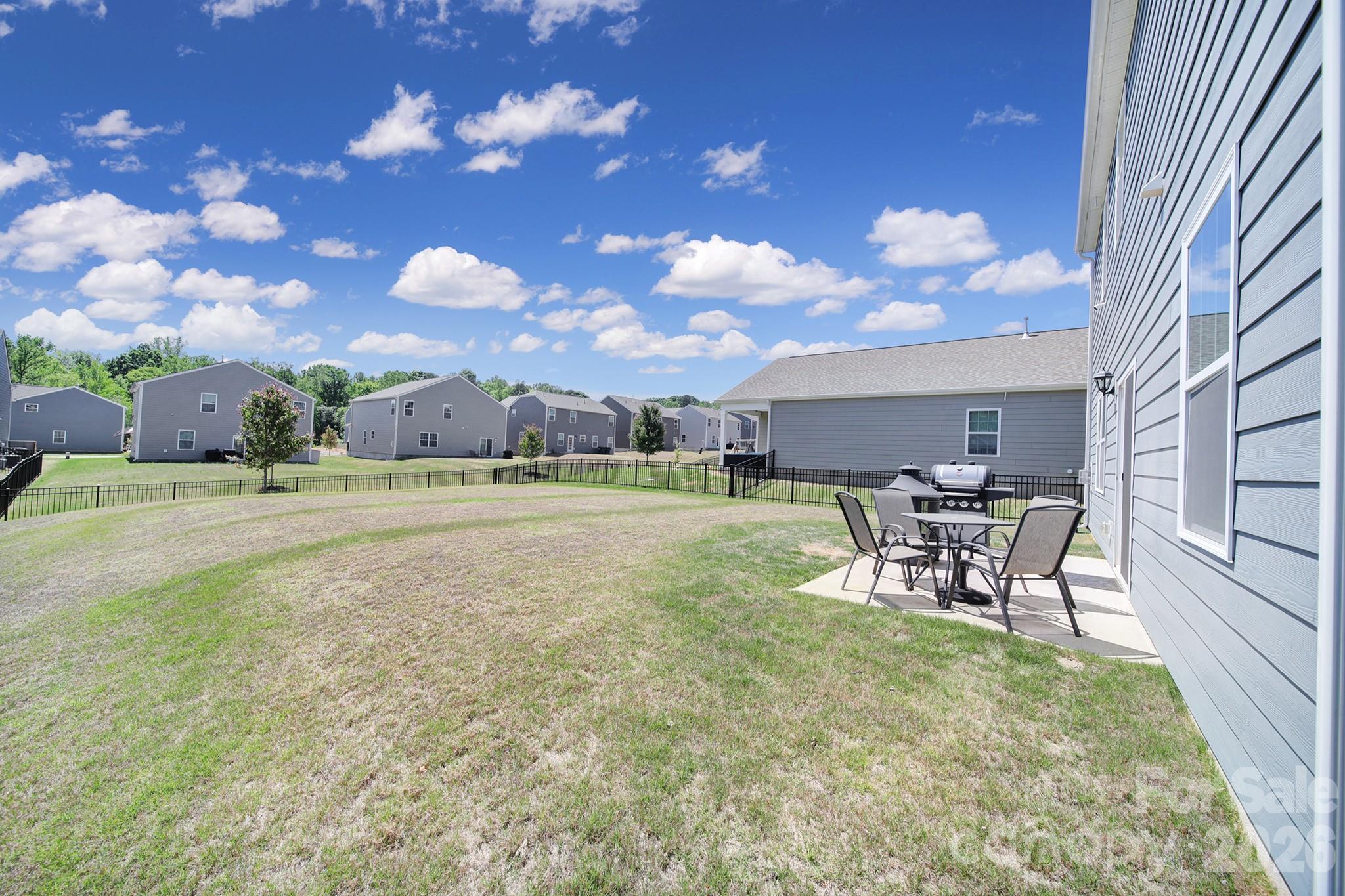 107 Spring Hall Court Troutman, NC 28166 - Photo 25 of 28 a view of a backyard with sitting area