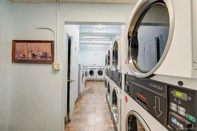 a view of a hallway with washer and dryer