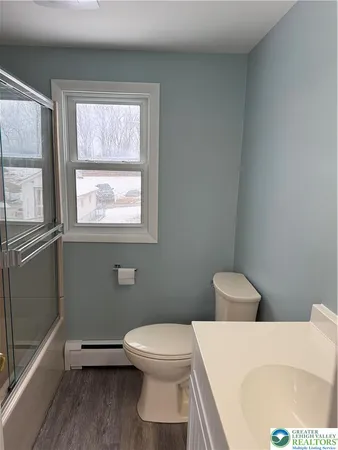 a bathroom with a toilet and a sink