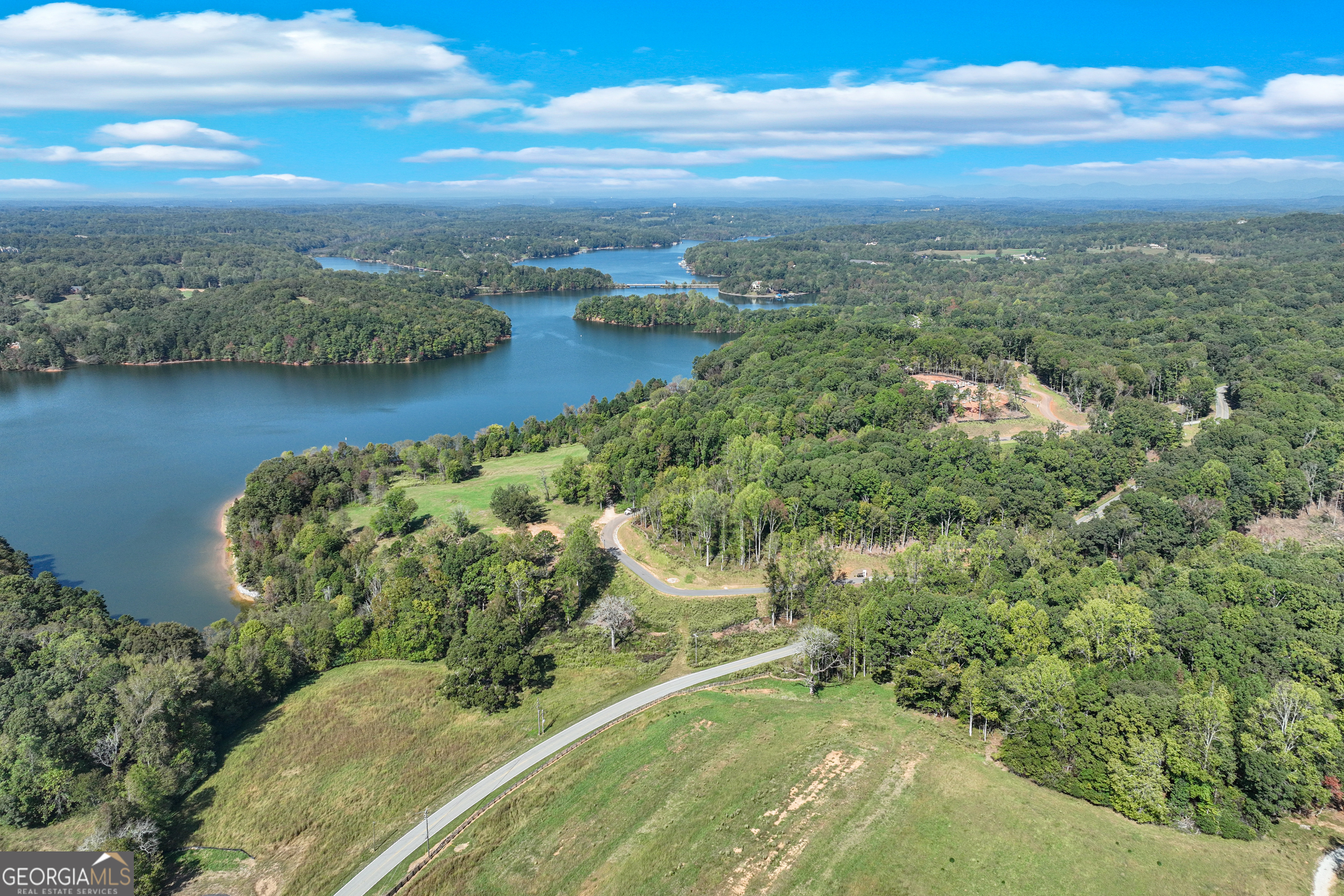 4638 Shirley Road, Unit LOT 2 Gainesville, GA 30506 - Photo 8 of 22 a view of a lake with a city