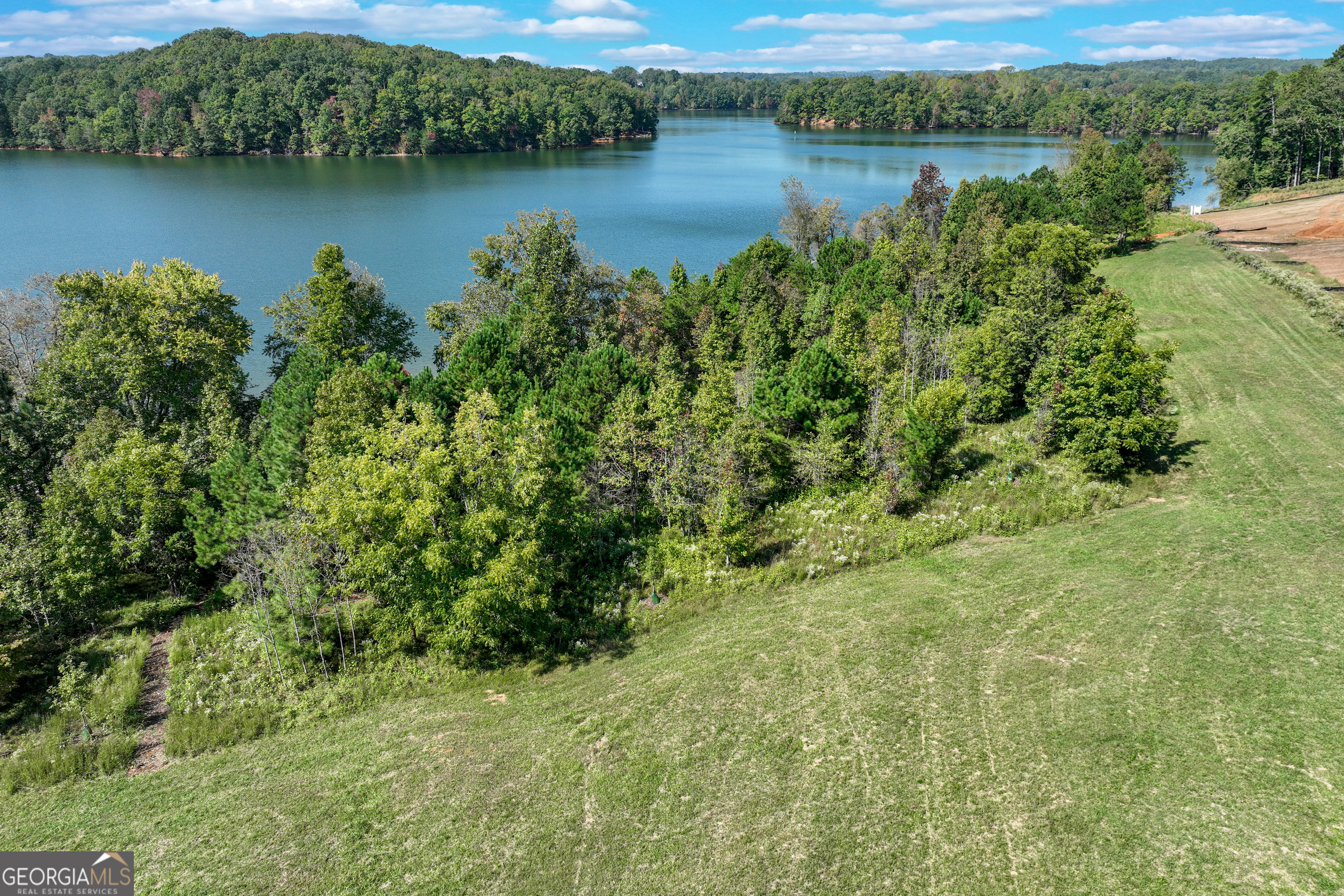 4638 Shirley Road, Unit LOT 2 Gainesville, GA 30506 - Photo 9 of 22 a view of a lake with houses in the back