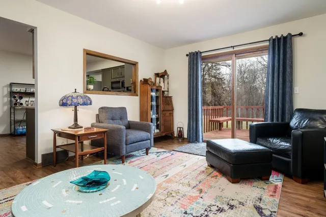 a kitchen with stainless steel appliances a stove top oven a sink and a refrigerator