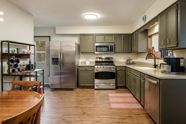 a kitchen with a sink and cabinets