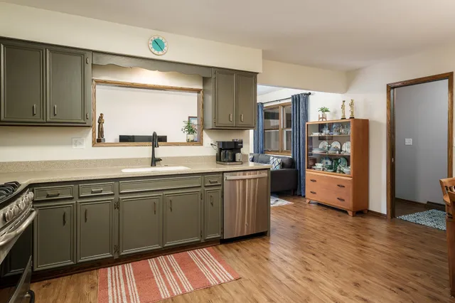 a living room with furniture large window and a table