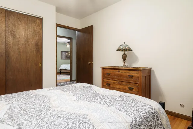 a bedroom with furniture and flat screen tv