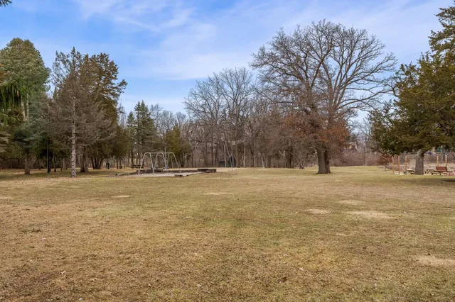 a view of a lake with trees by lake view