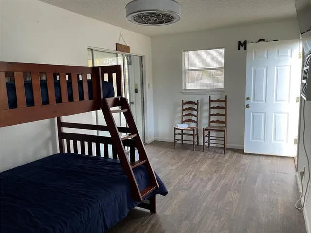 a bedroom with furniture and a window