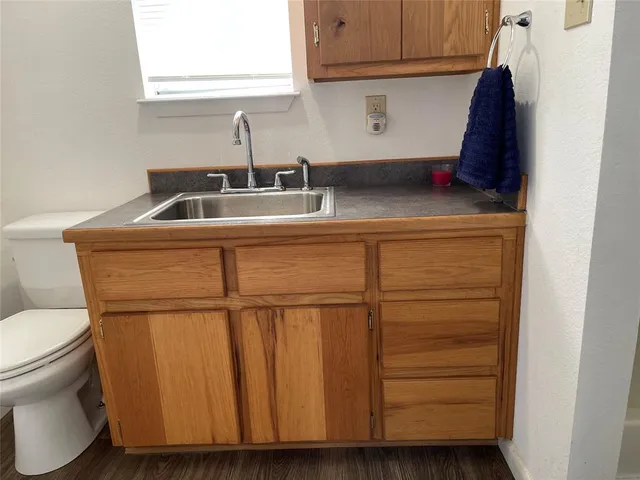 a kitchen with a sink and cabinets