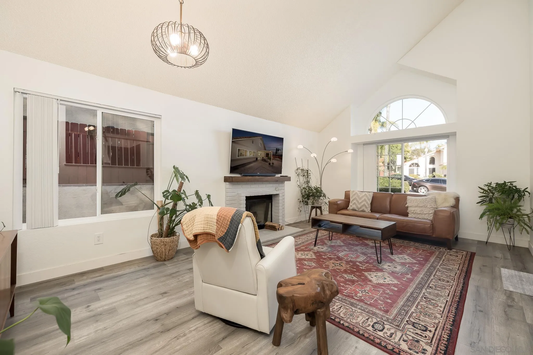 1678 Whitestone Road Spring Valley, CA 91977 - Photo 15 of 43 a living room with furniture a fireplace and a large window