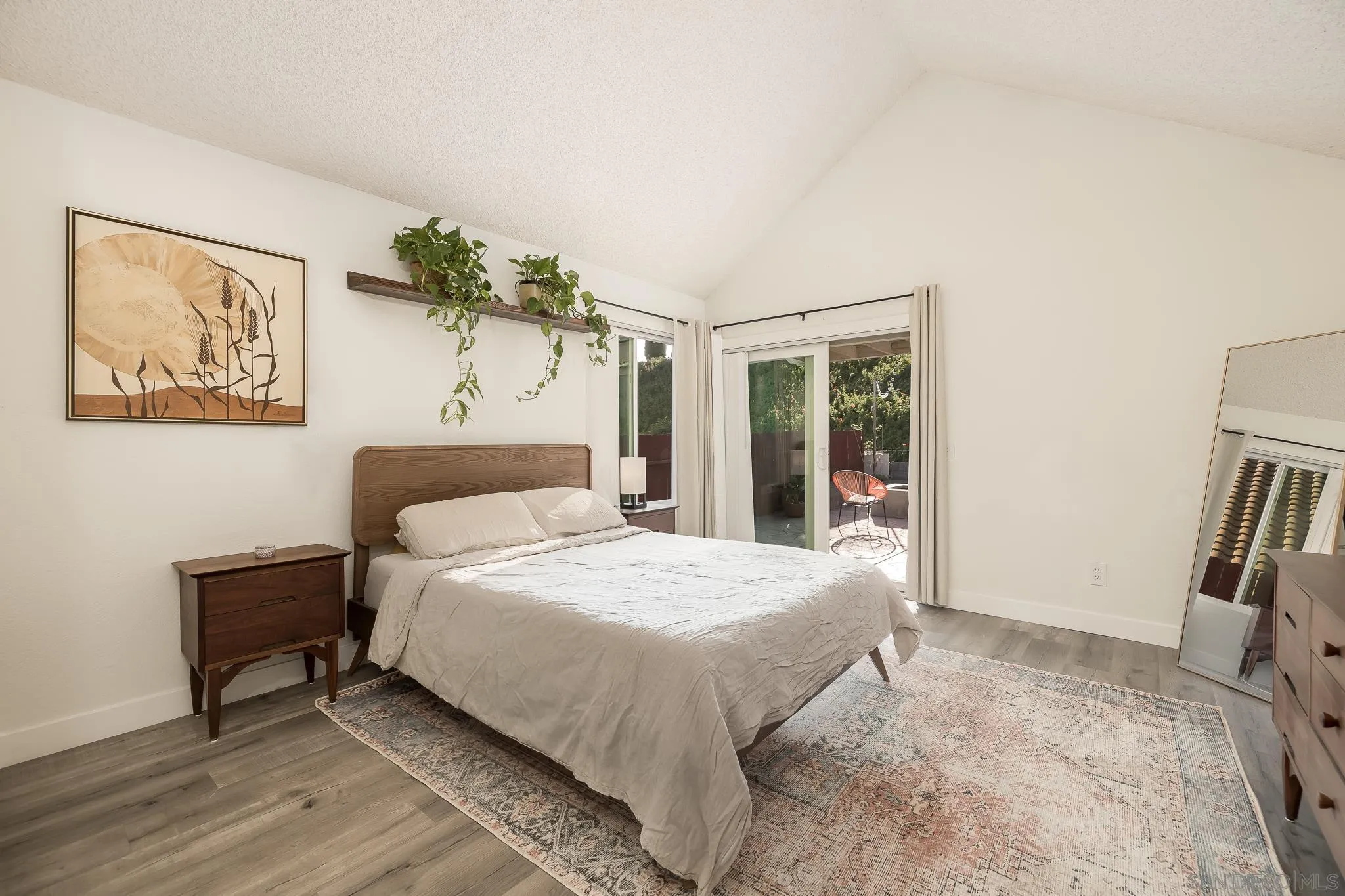 1678 Whitestone Road Spring Valley, CA 91977 - Photo 21 of 43 a bedroom with a bed and a painting on the wall