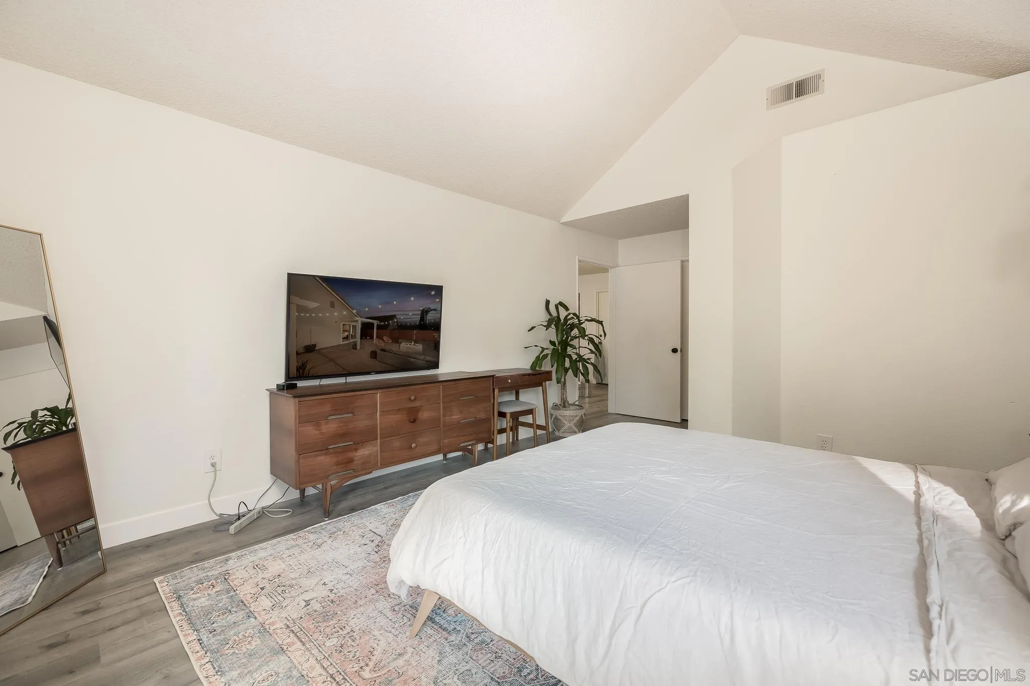 1678 Whitestone Road Spring Valley, CA 91977 - Photo 23 of 43 a bedroom with a bed and a flat screen tv