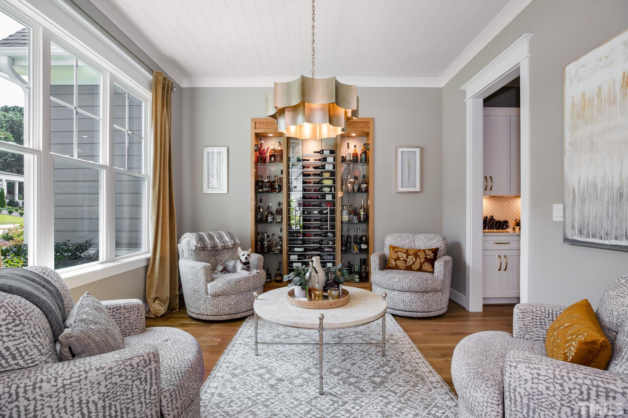 1420 Margrave Drive Wake Forest, NC 27587 - Photo 12 of 30 a living room with furniture chandelier and a large window