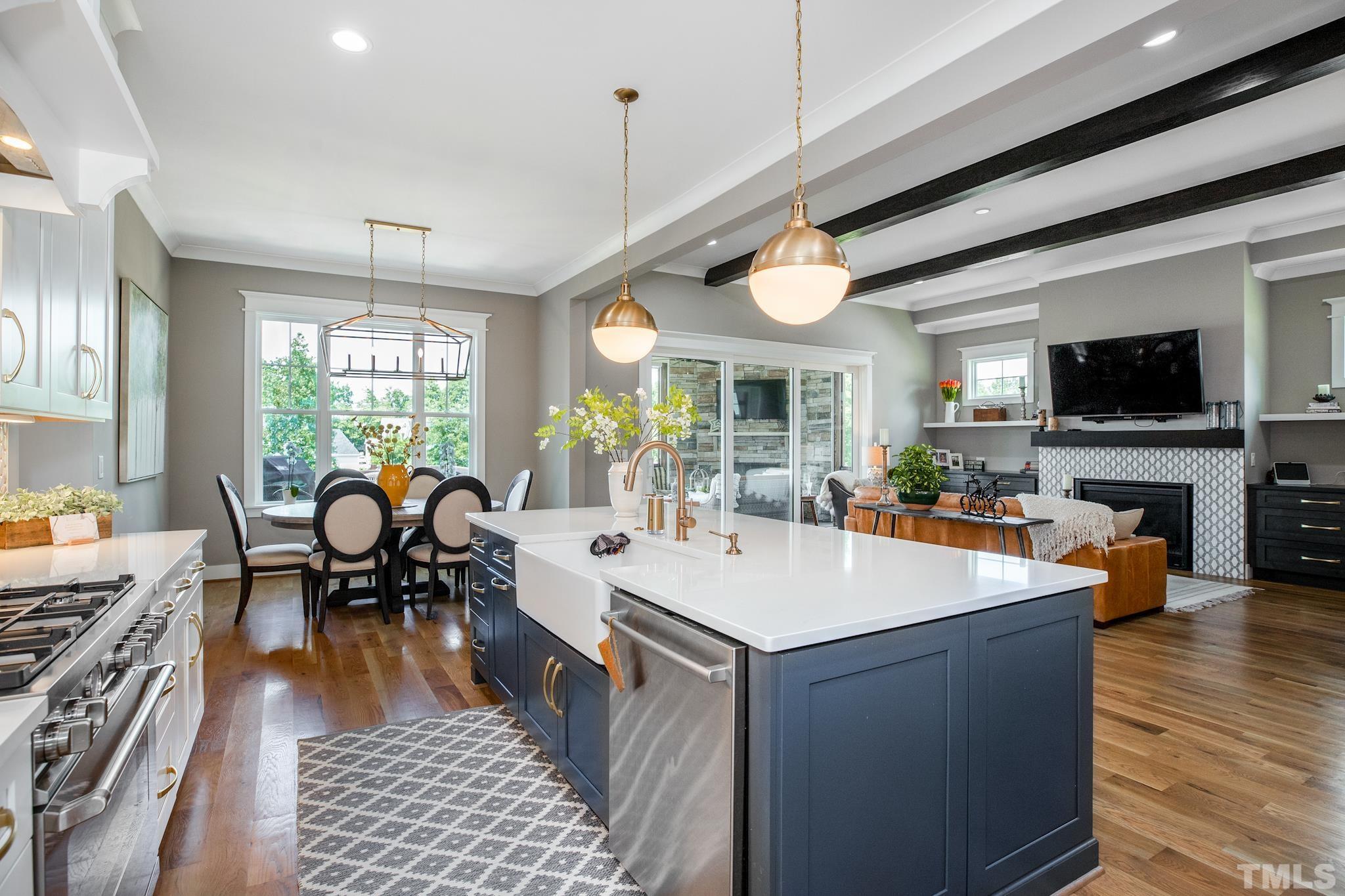 1420 Margrave Drive Wake Forest, NC 27587 - Photo 18 of 30 a large white kitchen with a table and chairs
