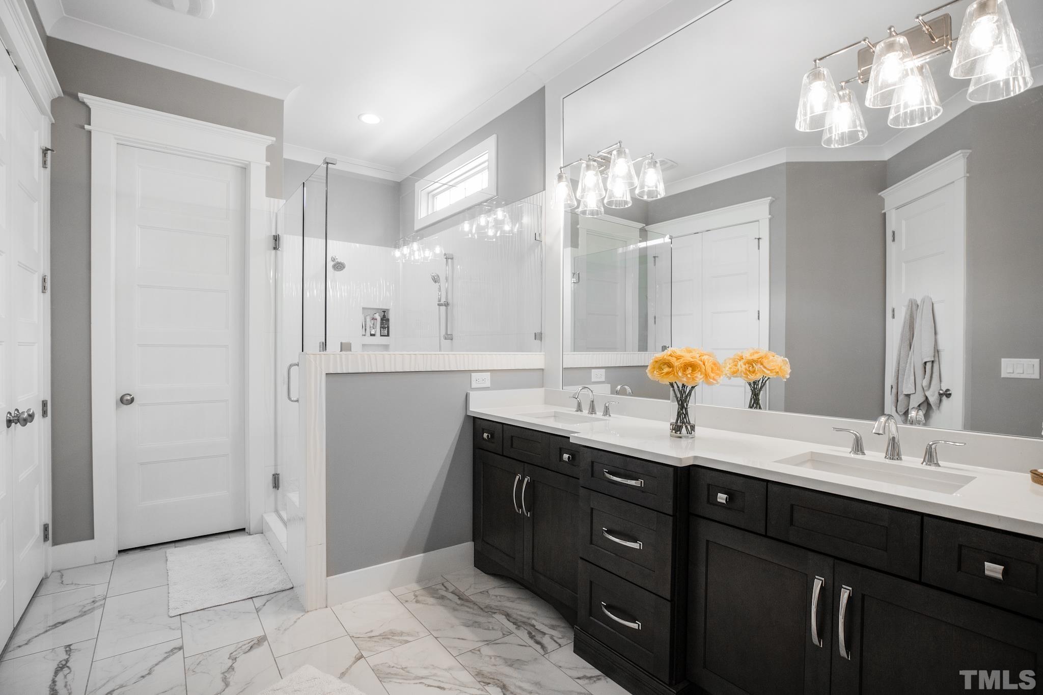 1420 Margrave Drive Wake Forest, NC 27587 - Photo 22 of 30 a bathroom with a granite countertop sink a large mirror and a shower