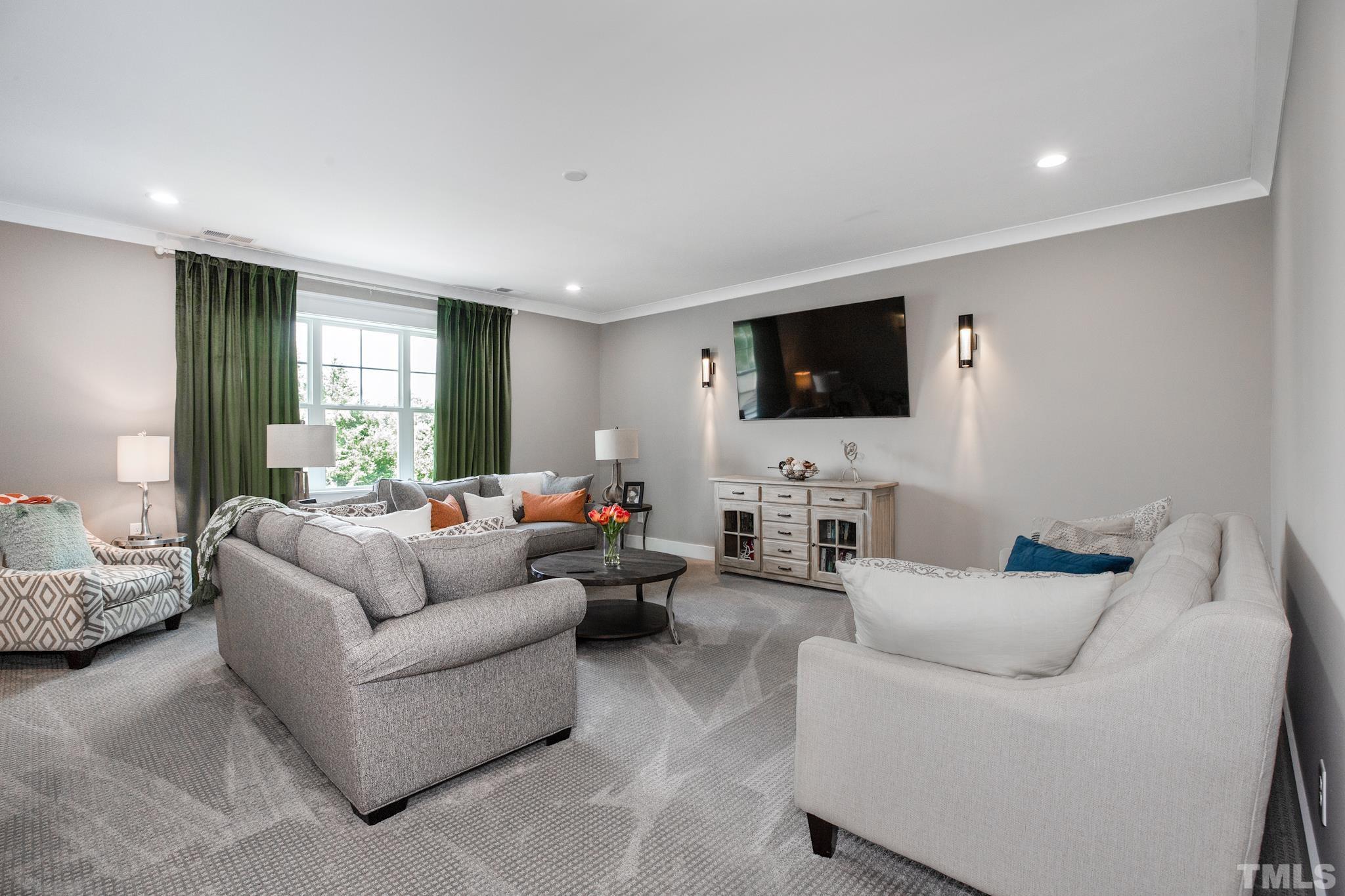 1420 Margrave Drive Wake Forest, NC 27587 - Photo 23 of 30 a living room with furniture and a flat screen tv
