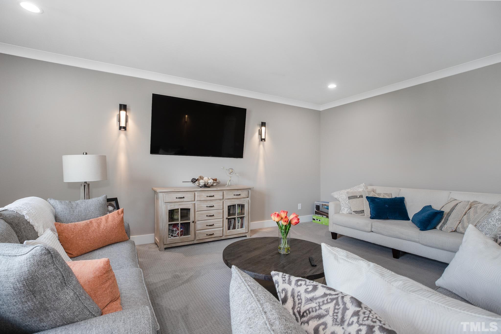 1420 Margrave Drive Wake Forest, NC 27587 - Photo 24 of 30 a living room with furniture and a flat screen tv