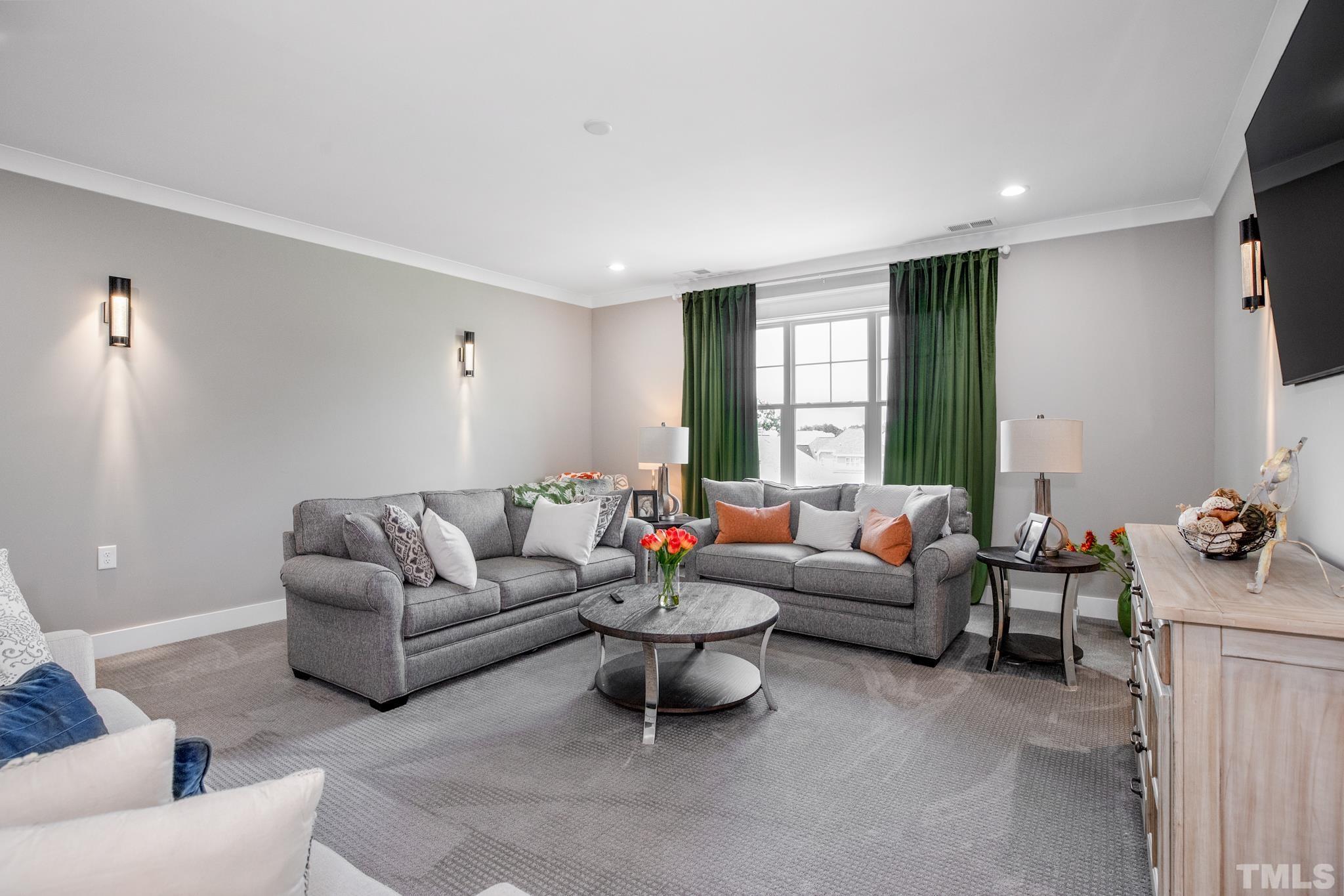 1420 Margrave Drive Wake Forest, NC 27587 - Photo 25 of 30 a living room with furniture and a large window