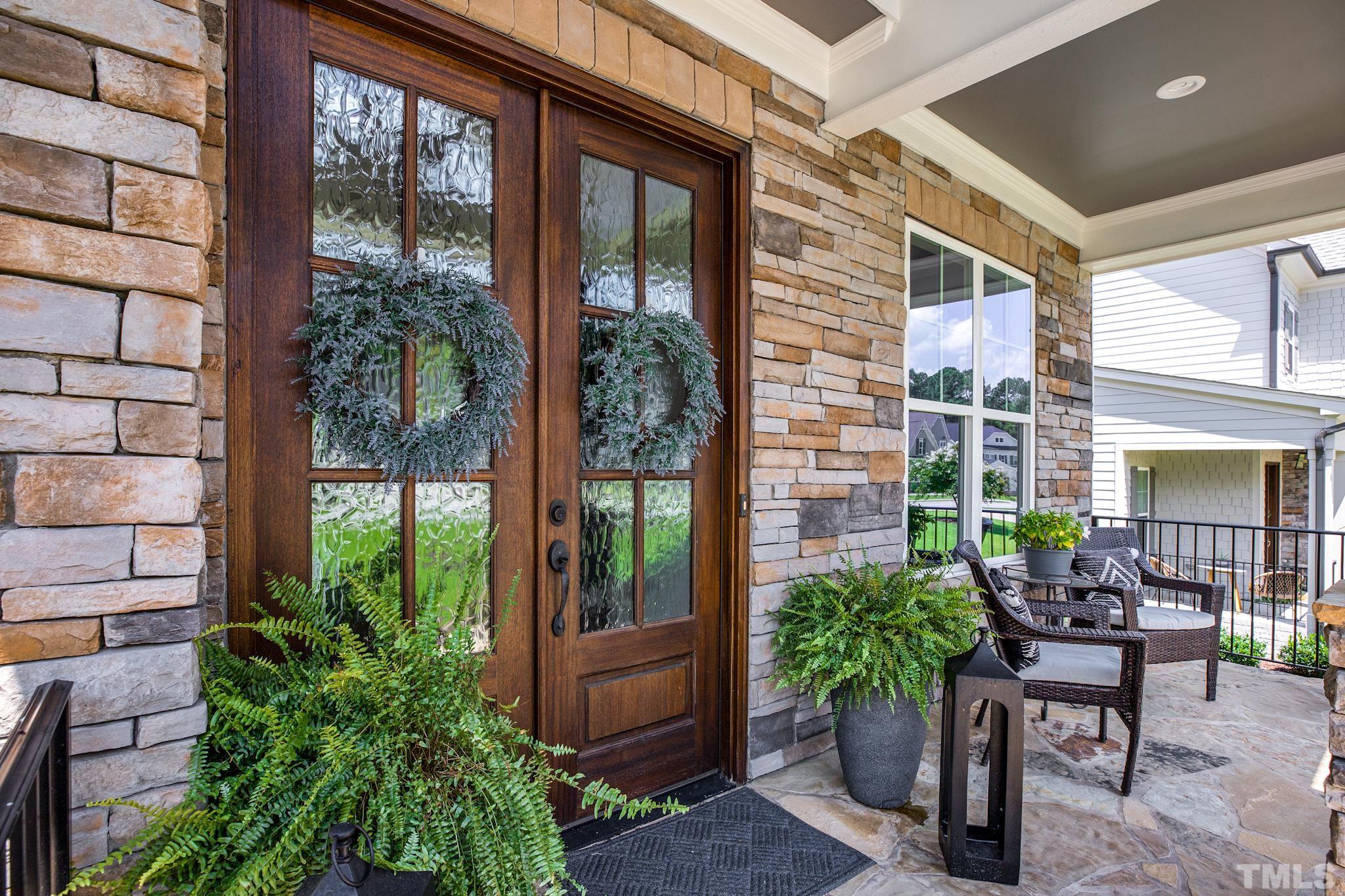 1420 Margrave Drive Wake Forest, NC 27587 - Photo 7 of 30 a view of a porch with chairs and potted plants