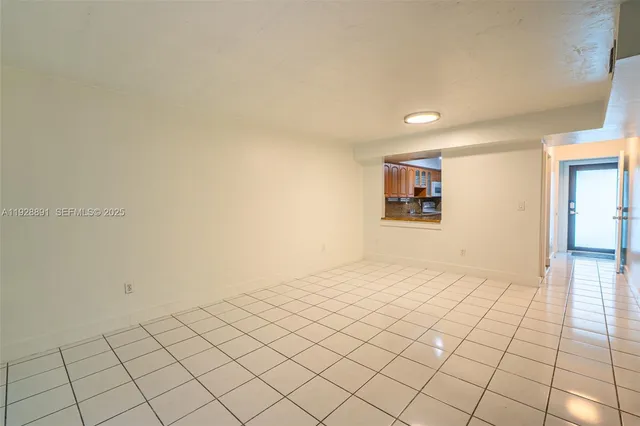 a view of an empty room and window