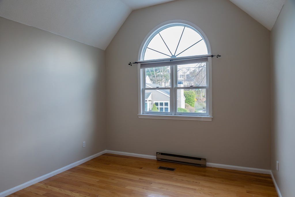 85 Bishops Forest Drive, Unit 85 Waltham, MA 02452 - Photo 24 of 32 an empty room with a window