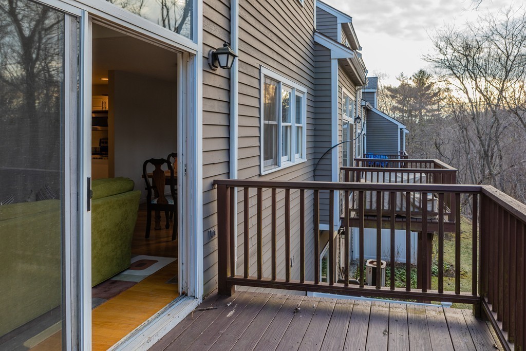 85 Bishops Forest Drive, Unit 85 Waltham, MA 02452 - Photo 29 of 32 a view of a balcony with a door