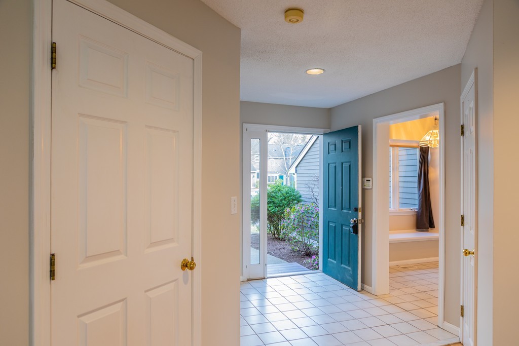 85 Bishops Forest Drive, Unit 85 Waltham, MA 02452 - Photo 7 of 32 a view of a hallway