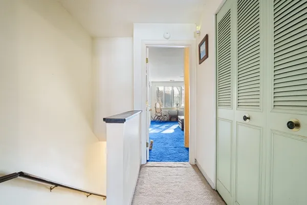 a view of a bathroom from the hallway