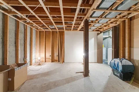 a front view of a house with outdoor seating