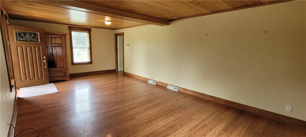 446 Eagle Mill Road Butler, PA 16001 - Photo 12 of 27 an empty room with wooden floor and windows