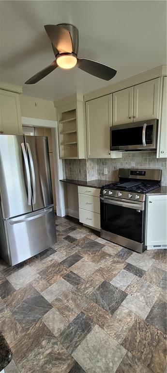 446 Eagle Mill Road Butler, PA 16001 - Photo 16 of 27 a kitchen with stainless steel appliances granite countertop a stove top oven a sink and a refrigerator