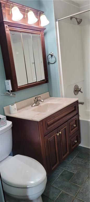 446 Eagle Mill Road Butler, PA 16001 - Photo 17 of 27 a bathroom with a toilet a sink and a mirror