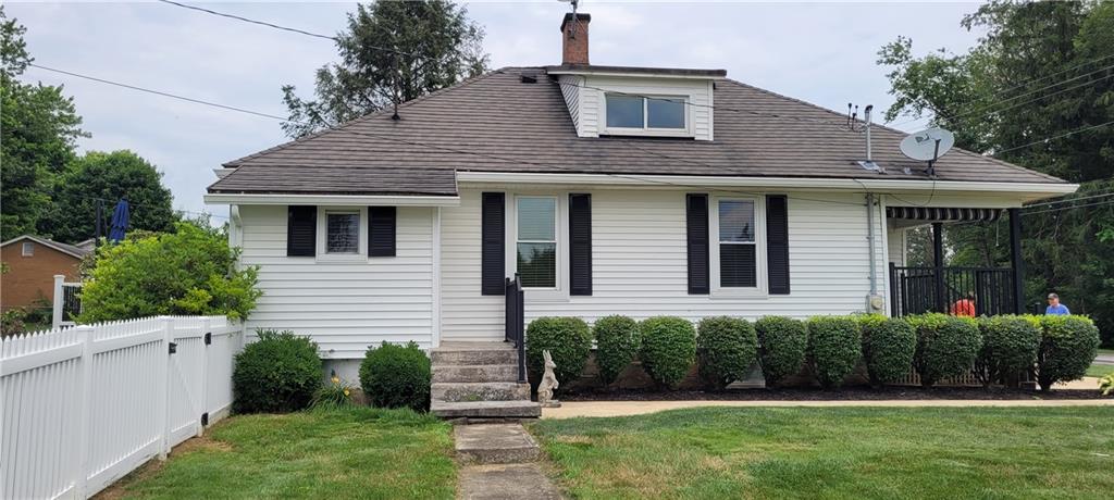 446 Eagle Mill Road Butler, PA 16001 - Photo 5 of 27 a front view of a house with a yard