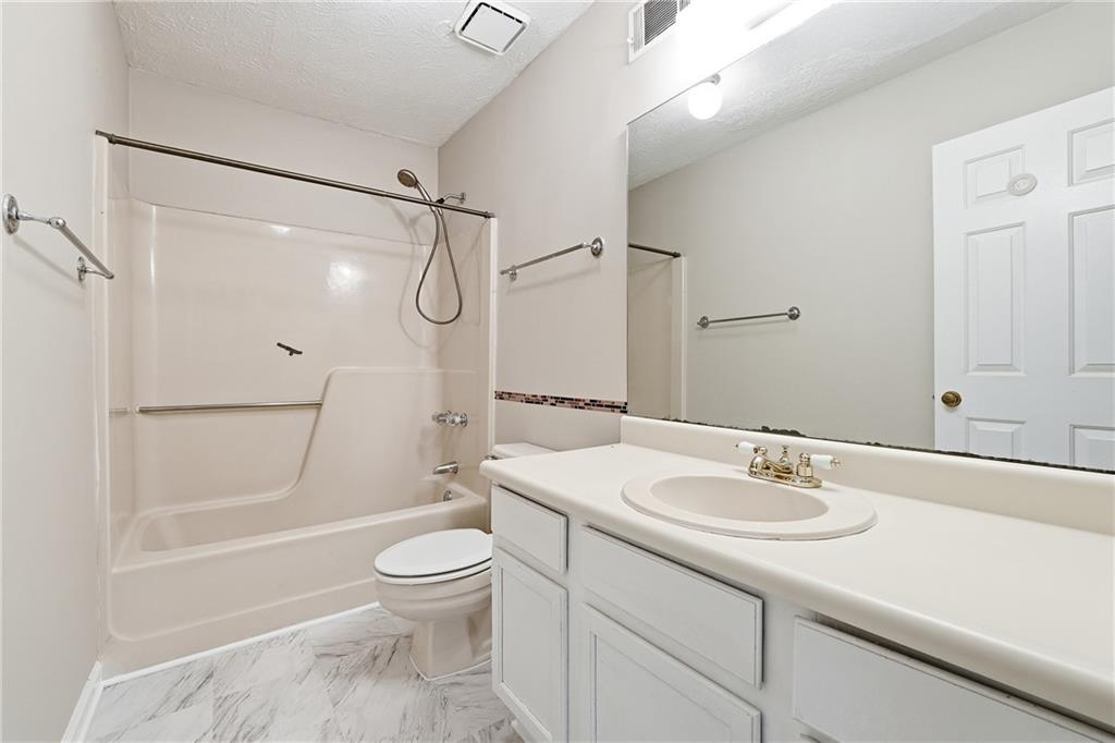 136 Sterling Court Alpharetta, GA 30004 - Photo 16 of 25 a bathroom with a sink toilet tub and shower