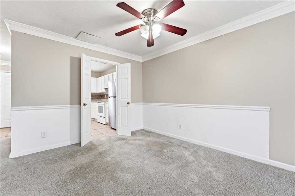 136 Sterling Court Alpharetta, GA 30004 - Photo 20 of 25 an empty room with closet and a ceiling fan