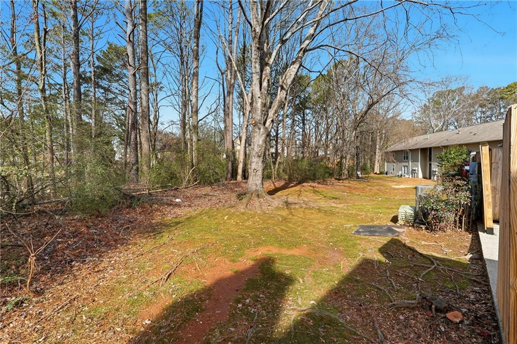 136 Sterling Court Alpharetta, GA 30004 - Photo 24 of 25 a view of a yard with trees in front of house