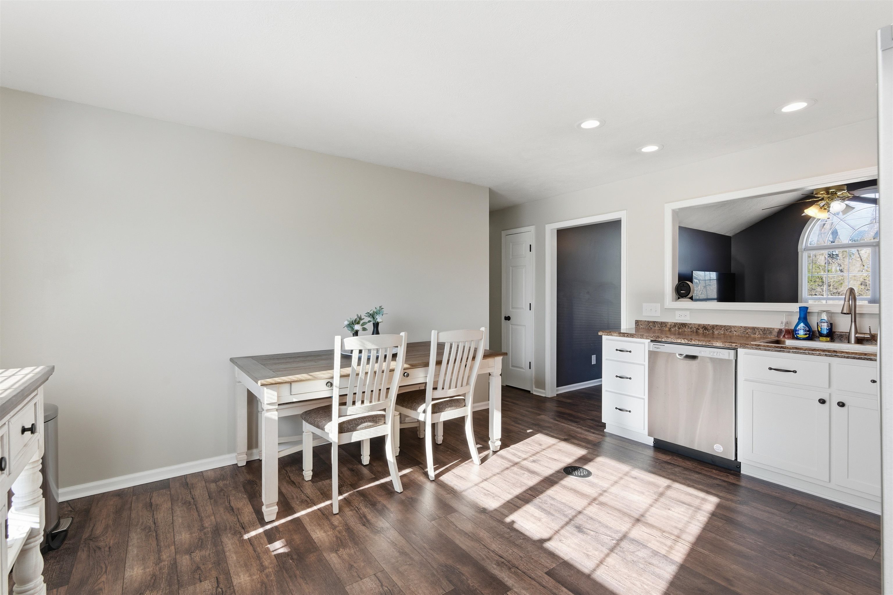 448 Stevens Road Bolivar, TN 38008 - Photo 13 of 25 Kitchen with white cabinetry, stainless steel dishwasher, ceiling fan, dark wood finished floors, and recessed lighting