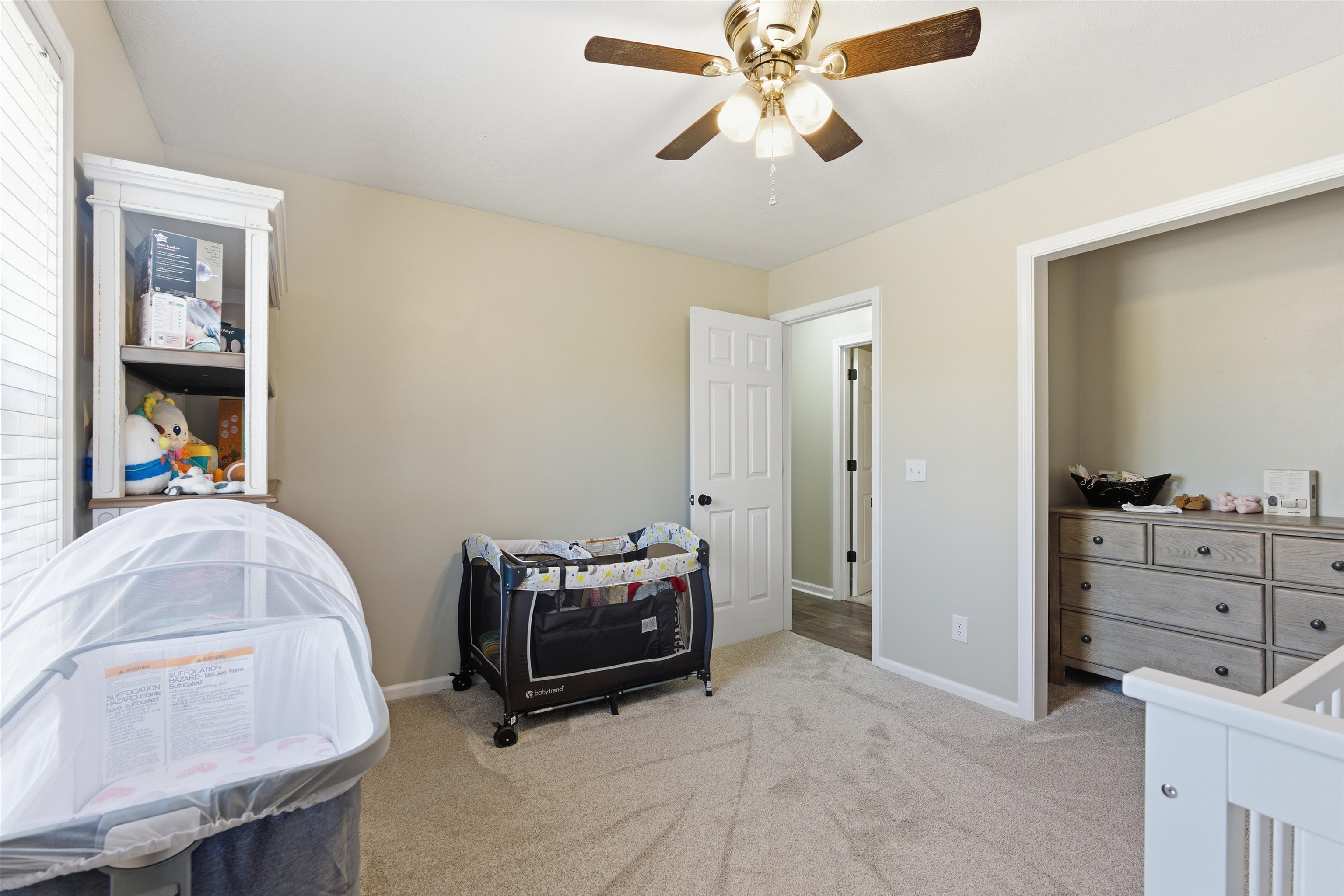 448 Stevens Road Bolivar, TN 38008 - Photo 18 of 25 Bedroom with light carpet and ceiling fan
