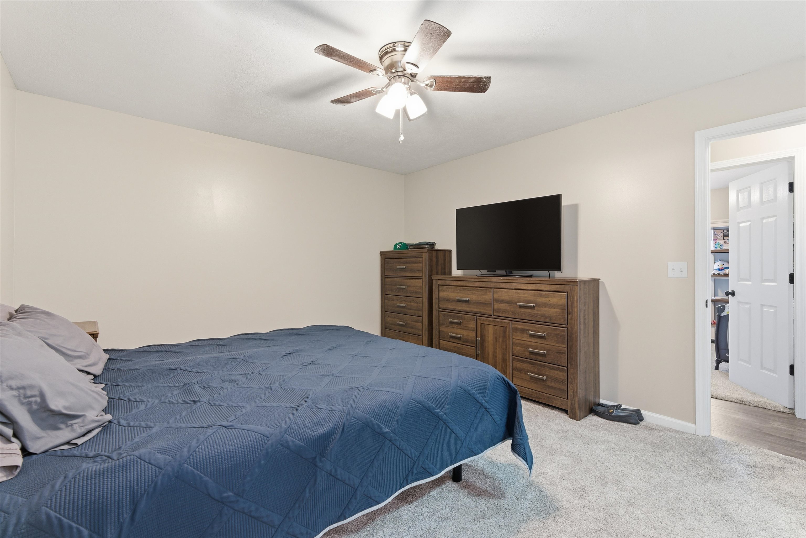 448 Stevens Road Bolivar, TN 38008 - Photo 19 of 25 Carpeted bedroom featuring ceiling fan and baseboards
